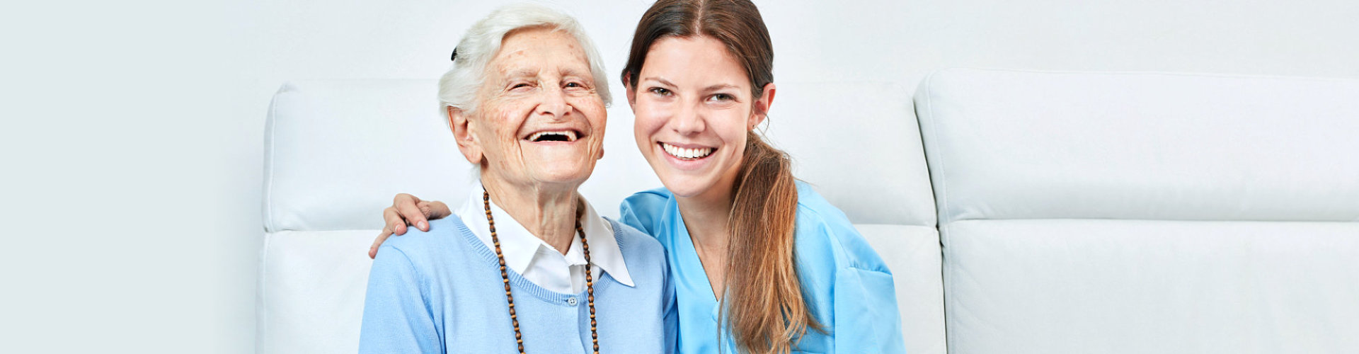young nurse and old woman smiling